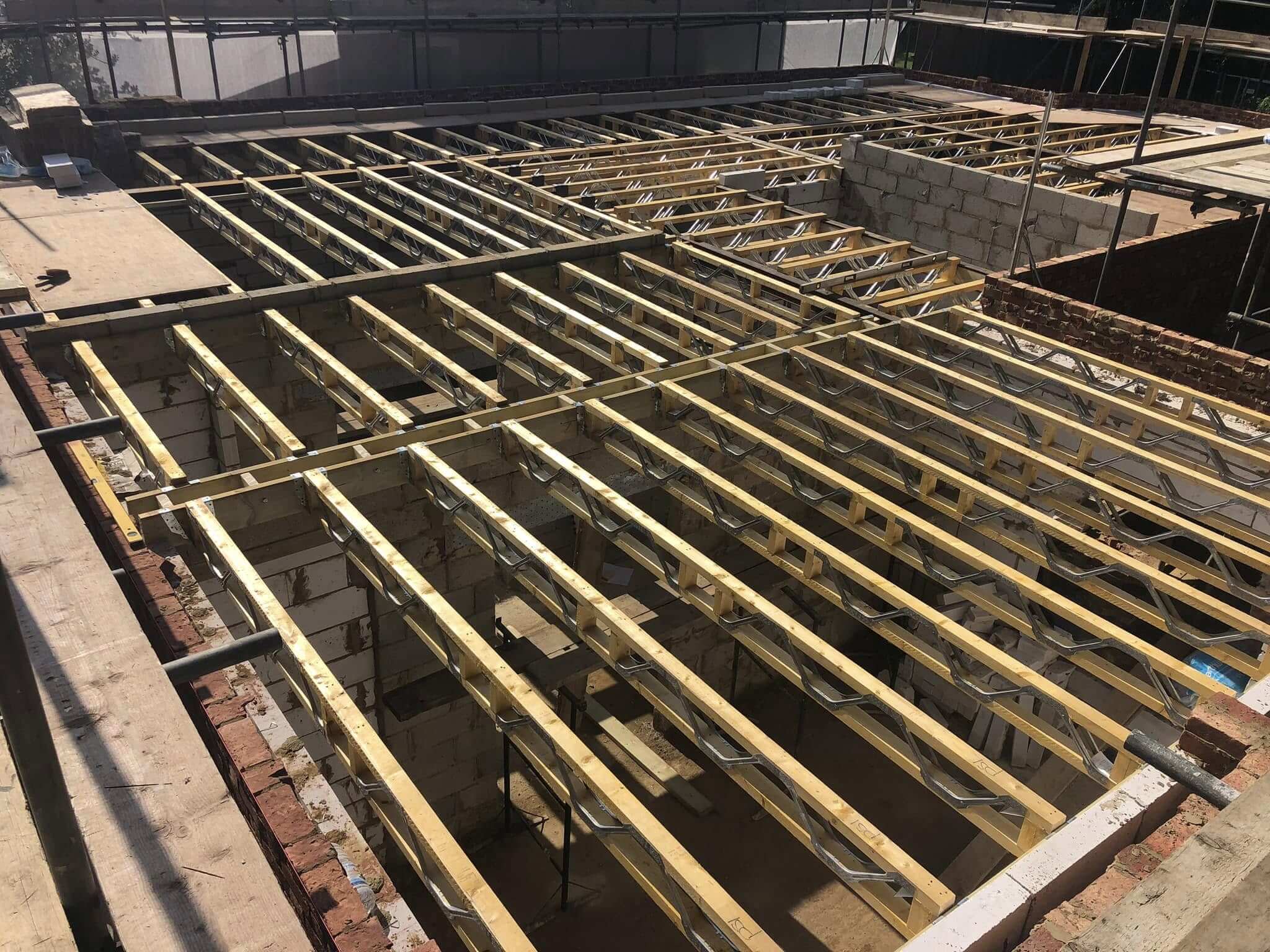 Engineered timber and steel floor joists installed across a new build extension